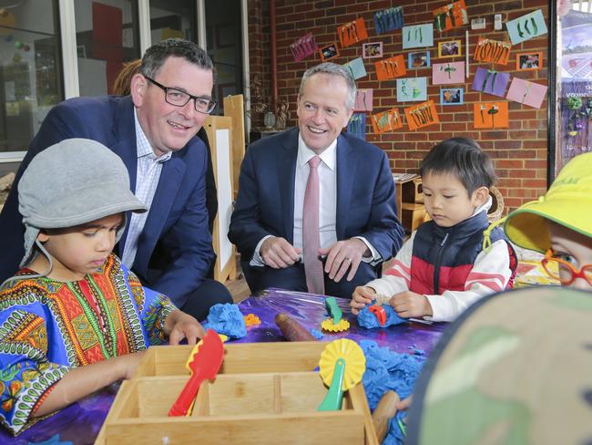 Opposition Leader Bill Shorten (centre) and Victorian Premier Daniel Andrews (second left) are seen during a visit to a preschool in Melbourne, Thursday, October 4, 2018. Labor have made a major kindergarten funding announcement. (AAP Image/Wayne Taylor) NO ARCHIVING