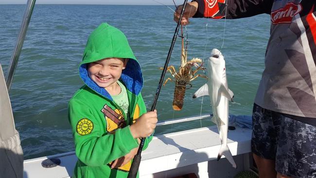 Bailey young was rapt when he managed to land both a crayfish and a shark recently.