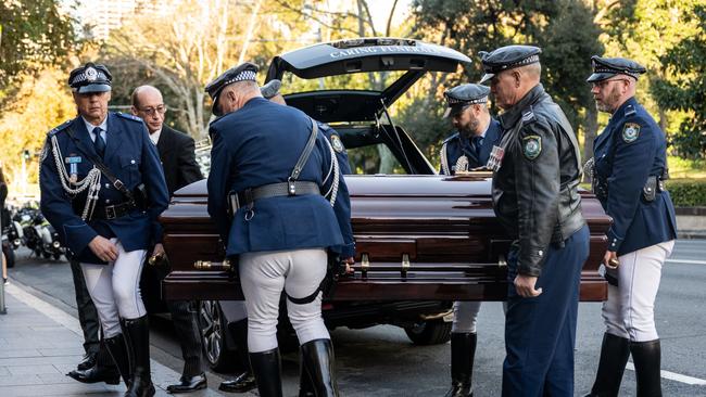 Bob Fulton's casket arrives at his state funeral at St Mary's Cathedral on Friday. Picture: AAP Image/James Gourley