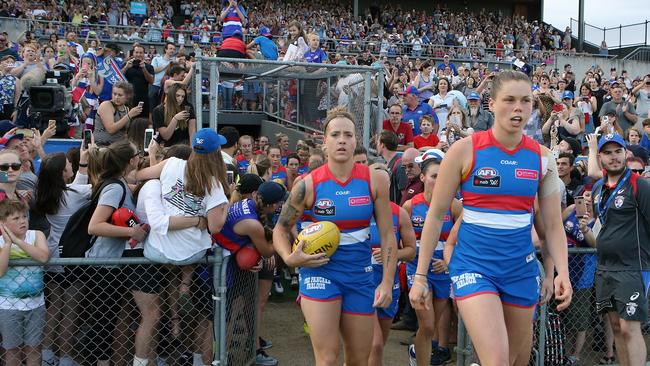 Katie Brennan leads the Bulldogs out on the field in front of a full house. Picture: Wayne Ludbey