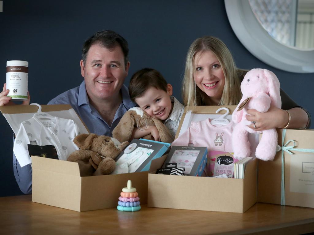 Hayley Stephens and her brother-in-law Rob Fagan have and Rob's son Carter test their Australian brands baby hampers. Picture: Jamie Hanson