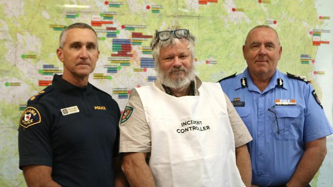 Tasmania Police Inspector Nick Clark, Tasmania Parks and Wildlife Service incident controller Robert Buck, and Tasmania Fire Service northern regional chief Jeff Harper discuss the fire in the Waterhouse Conservation Area. Picture: Stephanie Dalton