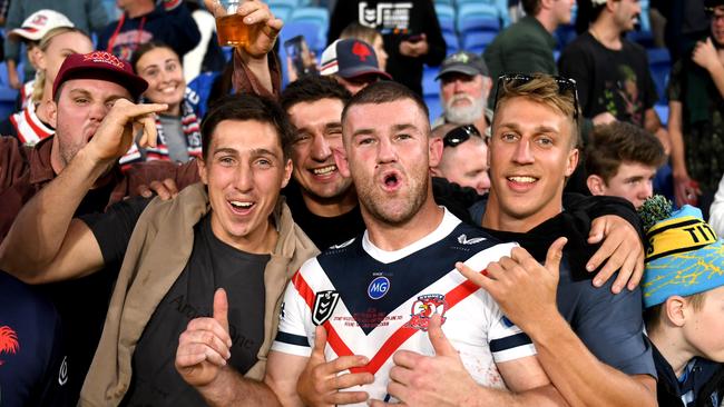 Roosters debutant Ben Thomas is joined by his mates, including Victor Radley. .