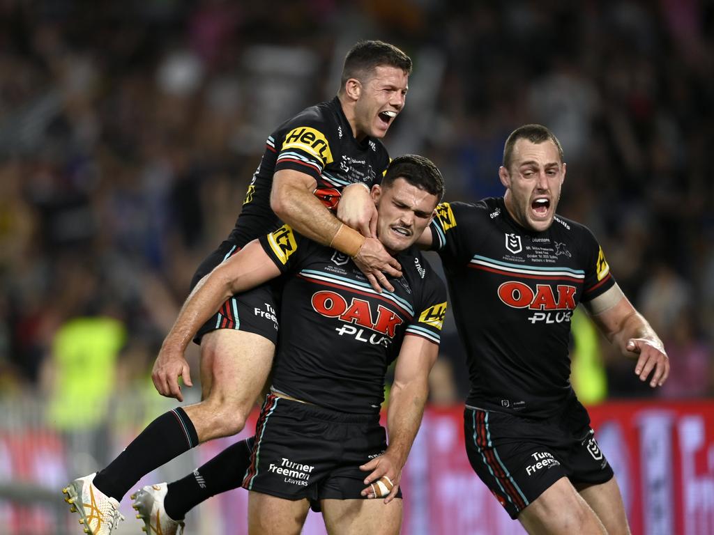 Jack Cogger (L) celebrates the game winning try with Nathan Cleary (C).