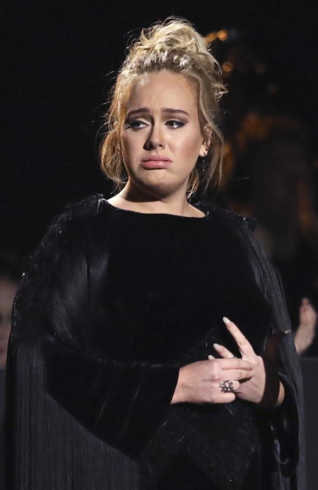 Adele reacts before restarting a performance tribute to George Michael during The 59th GRAMMY Awards at STAPLES Center on February 12, 2017 in Los Angeles, California. Picture: AP