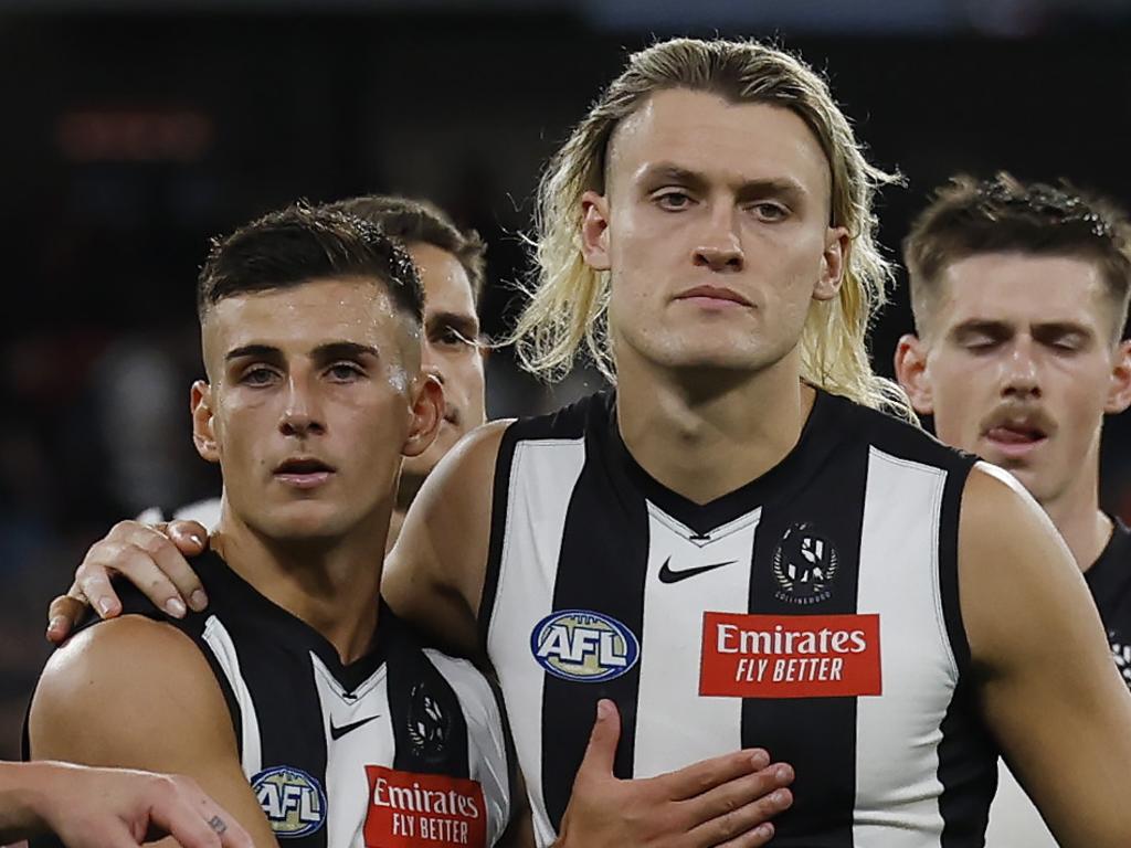 MELBOURNE, AUSTRALIA. March 15, 2024. AFLÃ&#137; Round 1. Collingwood vs. Sydney Swans at the MCG. Darcy Moore and Nick Daicos of the Magpies after tonights loss to Sydney. Pic: Michael Klein