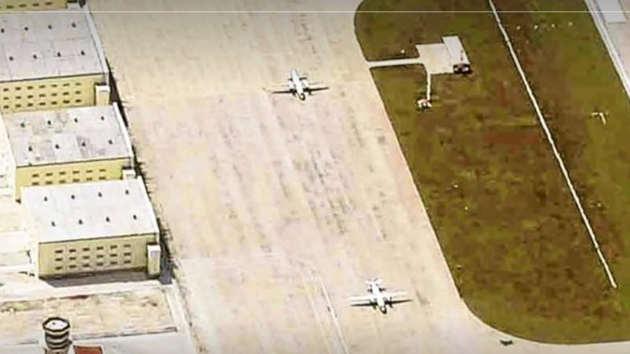 Two Chinese Y-7 military transport aircraft pictured on the tarmac at Mischief Reef, one of its illegal artificial islands constructed in the Spratly Islands over which the Philippines also lays territorial claim. Picture: via The Inquirer