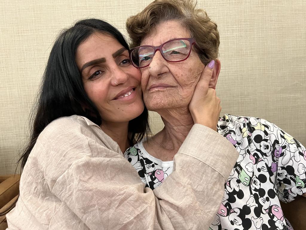 Mother of two Hen Biton, a refugee from Ashkelon near the Gaza border, fled her home after an armed Hamas parachuter landed in her street. Pictured with her grandmother Aviva Mahlfum, 84. Both are Israeli refugees in Tel Aviv. Picture: Danielle Gusmaroli