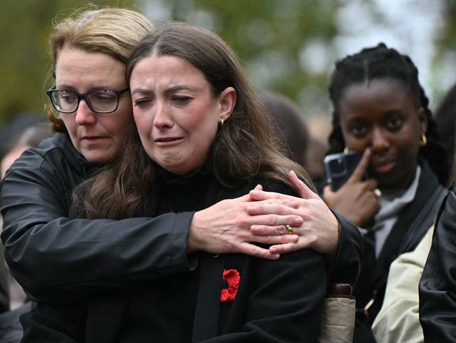 Fans of former One Direction singer Liam Payne gather beside the Peter Pan statue in Kensington Gardens, adjacent to Hyde Park for a memorial following the singer's death. Picture: AFP