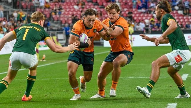 Australiaâs Hayden Sargeant runs with the ball during the men's Cup quarter-final match between Australia and South Africa at the HSBC Rugby Sevens tournament at the National Stadium in Singapore on May 4, 2024. (Photo by Roslan RAHMAN / AFP)