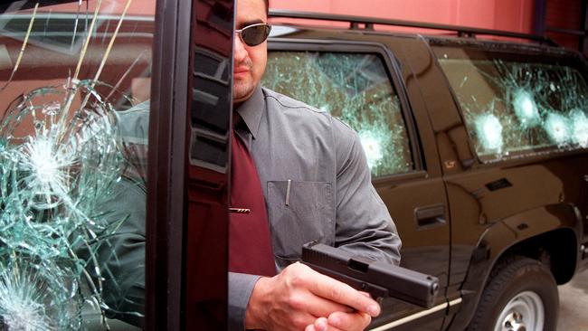 Unified Security’s Luigi Trunzo promoting bulletproof glass in the 1990s. Picture: News Corp Australia