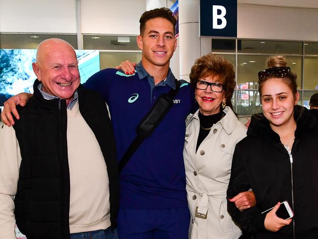 Mark Nawaqanitawase is greeted by family members. Picture: Rugby AU Media/Stuart Walmsley