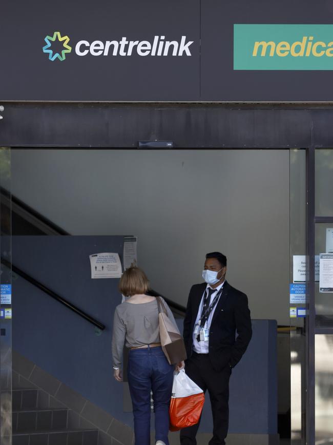 A woman walks into Centrelink in Chatswood, Sydney. Picture: NCA NewsWire / Damian Shaw