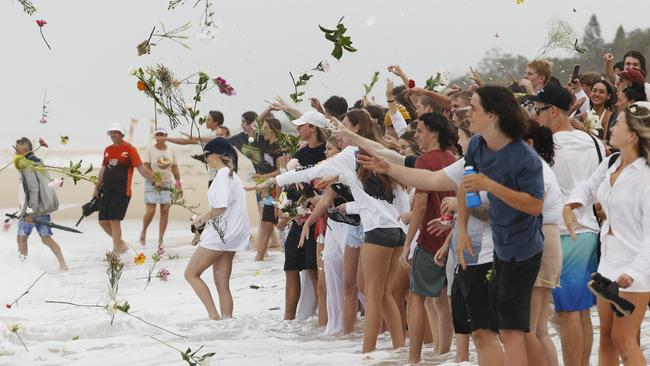 Family and friends of Balin Stewart took to his home beach at Buddina this week to pay tribute. Picture: Lachie Millard