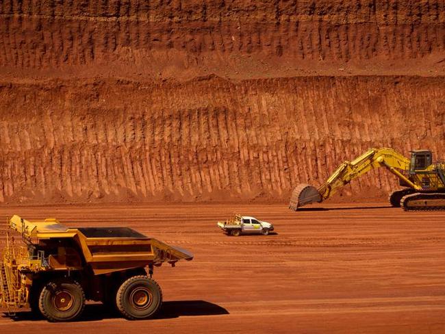 FILE PHOTO: Machinery operates in a pit at Rio Tinto Group's West Angelas iron ore mine in Pilbara, Australia, on Sunday, Feb. 19, 2012. Rio Tinto Group said Chief Executive Officer Tom Albanese will step down, after announcing a surprise $14 billion impairment. Sam Walsh, head of the iron-ore division, has been appointed as his successor with effect from today, the company said in a statement. Photographer: Ian Waldie/Bloomberg via Getty Images