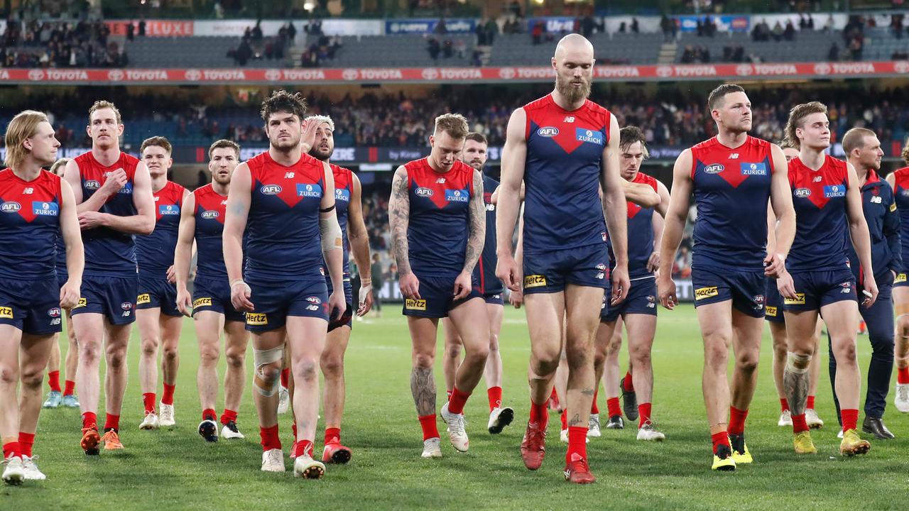 MELBOURNE, AUSTRALIA - SEPTEMBER 09: The Demons look dejected after a loss during the 2022 AFL Second Semi Final match between the Melbourne Demons and the Brisbane Lions at the Melbourne Cricket Ground on September 9, 2022 in Melbourne, Australia. (Photo by Michael Willson/AFL Photos via Getty Images)