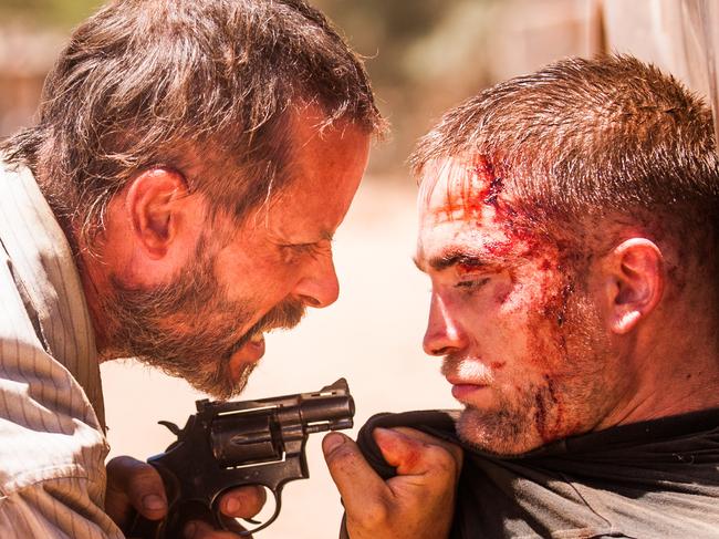 Guy Pearce (left) and Robert Pattinson in a scene from Australian film The Rover