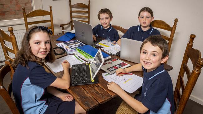 Anna, 11, Tom, 7, Fred, 7 and Emily, 9 all do their remote learning at the dining table. Picture: Jake Nowakowski