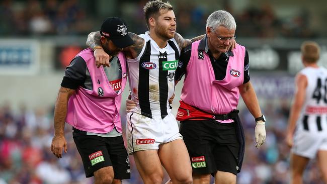 Jamie Elliott is helped off the field. Picture: Getty Images