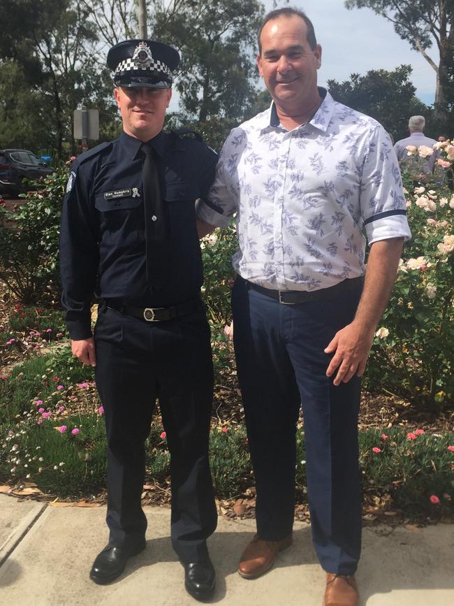 Glen and Todd at Glen’s graduation from the police academy.