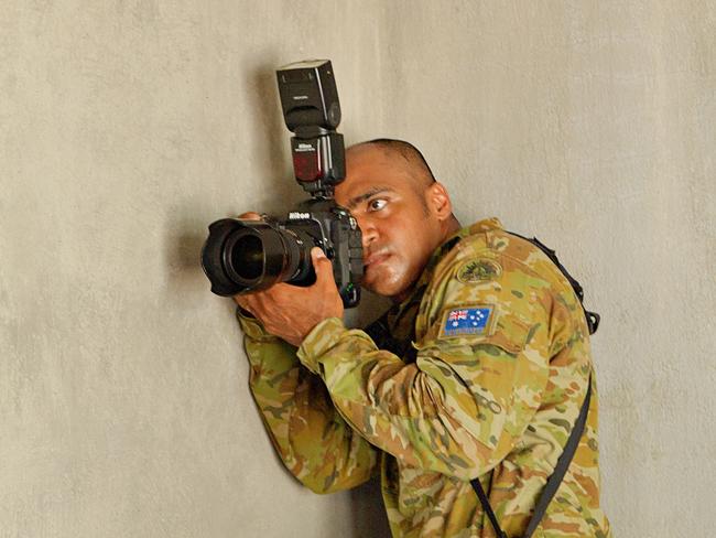 Australian Army photographer Corporal (Cpl) Nunu Campos on the job at the Metinaro Health Clinic. Exercise Hari'i Hamutuk, operating out of Metinaro in East Timor is running for the fourth time led by the Darwin based unit 1st Combat Engineer Regiment (1CER).