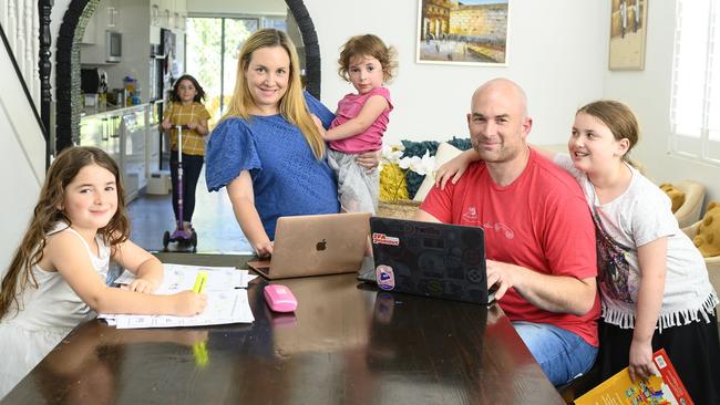 Candice Meisels and husband Michael with four of their five children. Candice has created a daily timetable for the kids after their daycare and schools closed. Picture: Darren Leigh Roberts