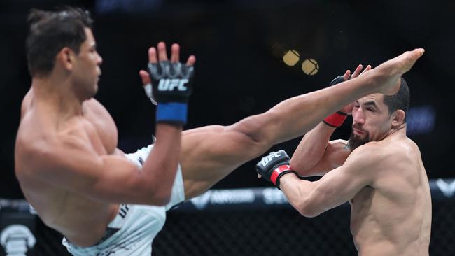 Robert Whittaker cops a brutal kick to the head. (Photo by Sean M. Haffey / GETTY IMAGES NORTH AMERICA / Getty Images via AFP)