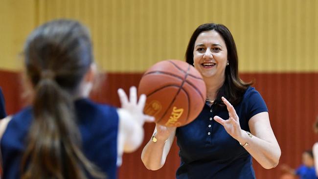 Queensland Premier Annastacia Palaszczuk playing basketball with members of the Wizards Basketball club on Saturday. (AAP Image/Darren England)