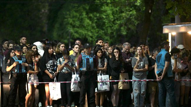 Fans gather at the scene.