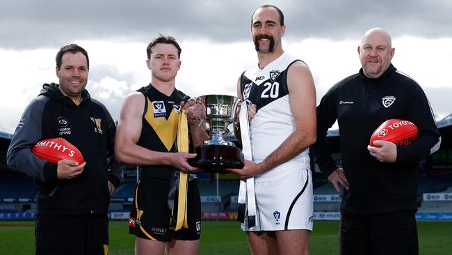 MELBOURNE, AUSTRALIA - SEPTEMBER 15: (L-R) Werribee coach Jimmy Allan, captain Dom Brew + Southport Sharks captain Brayden Crossley and coach Steve Daniel pose during the VFL Grand Final Media Opportunity at Ikon Park on September 15, 2024 in Melbourne, Australia. (Photo by Michael Willson/AFL Photos)