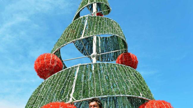 Leading Hand Tony Chapman from Gympie Regional Council putting the finishing touches to an earlier new Christmas tree at Nelson Reserve. Picture: Greg Miller