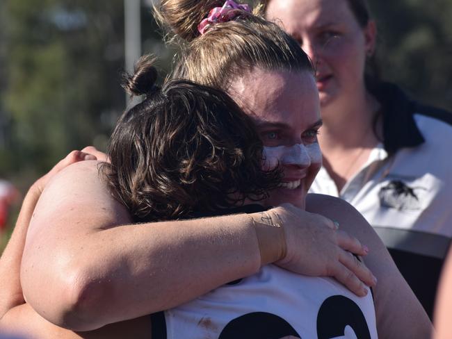 Laura Jonassen and Hayley Richmond embrace after the Rockhampton Panthers' grand final win.