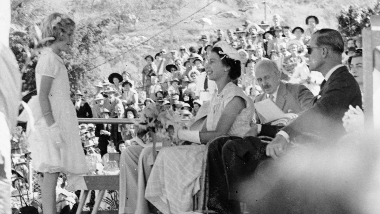 Robyn Lewise Breinl, 8, daughter of the Deputy Mayor Dr John Breinl, presents a bouquet of orchids to Queen Elizabeth at the civic reception at the Sports Reserve, Townsville, March 12 1954. Picture: Townsville City Libraries