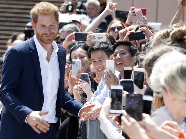 Harry stopped to pose for many happy snaps as he kept the crowd entertained. Picture: Paul Edwards/AP