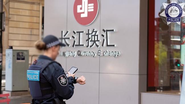 Police executing a search warrant at Changjiang Currency Exchange in the Sydney CBD conducted as part of Operation Avarus-Nightwolf.