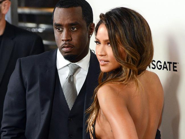 (FILES) Sean P. Diddy Combs with Cassie Ventura attend the premiere of 'The Perfect Match' at the Arclight Theatre in Los Angeles on March 7, 2016. Superstar rapper and music industry mogul Sean Combs was sued November 16 by the singer Cassie, who accused him of rape and physical abuse.  The hip-hop artist, known as both Puff Daddy or Diddy, subjected the R&B singer, whose real name is Casandra Ventura, to more than a decade of coercion by physical force and drugs as well as a 2018 rape, she said in her suit, filed in federal court in Manhattan. (Photo by Chris Delmas / AFP)