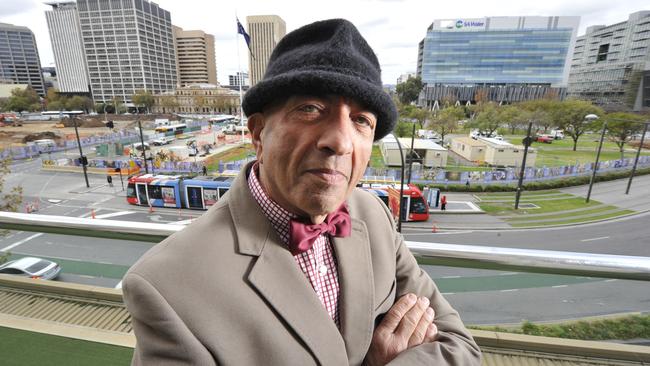 Arnie Rossis has owned several cafes around town and ran several times for lord mayor. He is angry at council decision not to build cafes in Vic Square. Pics of him in the square (and I am trying to get permission to use Hilton bar balcony)