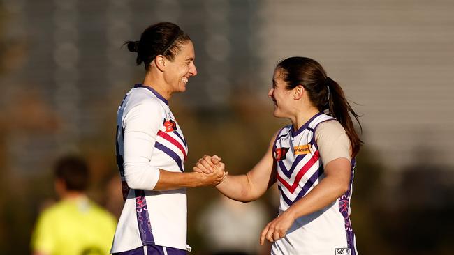 Ashleigh Brazill (left) and Gabby O'Sullivan celebrate Fremantle’s win over Essendon on Saturday. (Photo by Michael Willson/AFL Photos via Getty Images)