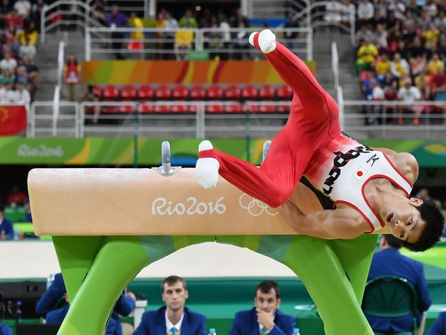 Japan's Koji Yamamuro falls from the pommel horse during the men's team final of the Artistic Gymnastics at the Olympic Arena during the Rio 2016 Olympic Games in Rio de Janeiro on August 8, 2016. / AFP PHOTO / Ben STANSALL