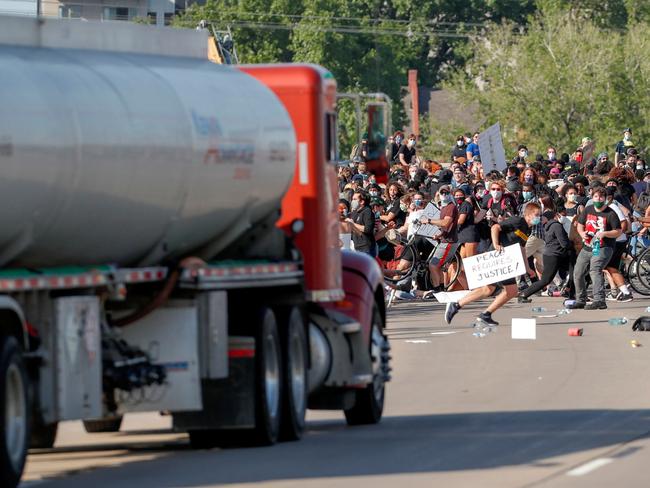 A tanker truck drives into thousands of protesters marching on 35W north bound highway during a protest against the death in Minneapolis police custody of George Floyd. Picture: Reuters