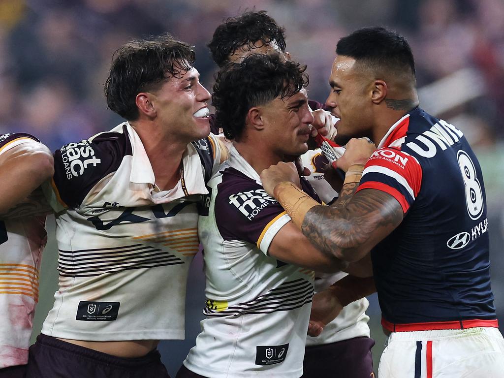 Spencer Leniu clashes with Broncos players. Picture: Ezra Shaw/Getty Images