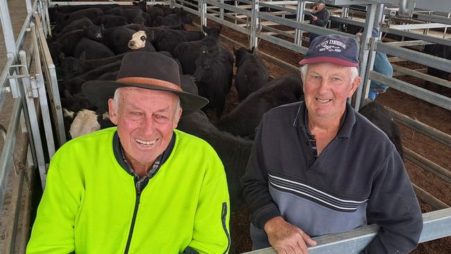 Neighbours Kevin Stephens and Ian Shaw, Mt Prospect, noticed a stark improvement in cattle prices at Ballarat today compared to a month ago. Mr Stephens received $1980 for Angus yearling steers that weighed 470kg today. In March, Mr Shaw sold Angus steers at 443kg for $1660. Selling agents quoted today’s market as $100 to $150 dearer. Picture: Jenny Kelly