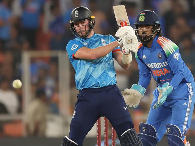 AHMEDABAD, INDIA - FEBRUARY 12: Gus Atkinson of England pulls a delivery to the legside as India wicketkeeper KL Rahul looks on during the 3rd ODI match between India and England at Narendra Modi Stadium on February 12, 2025 in Ahmedabad, India.  (Photo by Michael Steele/Getty Images)