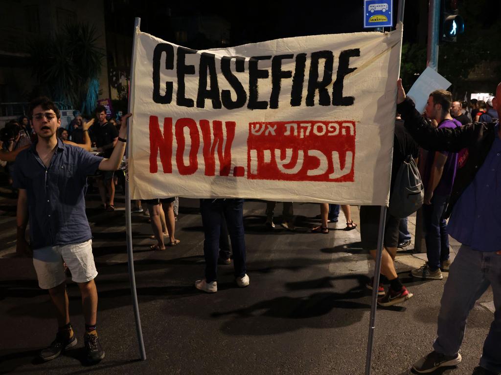 Protesters hold a banner as they march to call for the release of Israelis held hostage by Palestinian militants in Gaza. Picture: Ahmad/Gharabli/AFP