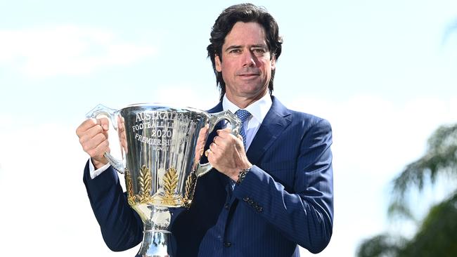 AFL Chief Executive Gillon McLachlan poses with the premiership trophy on the Gold Coast. Picture: Getty Images