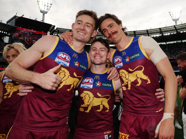 Harris Andrews, Lachie Neale and Joe Daniher celebrate winning the AFL Grand Final after defeating the Sydney Swans at the MCG. Picture Lachie Millard