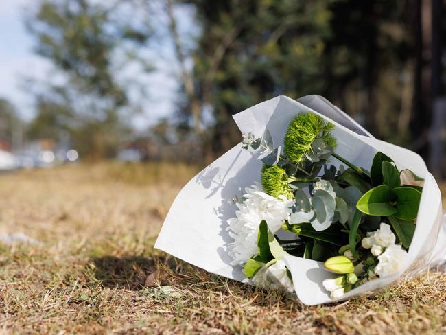 Flowers laid at the scene of the tragedy. Picture: David Swift