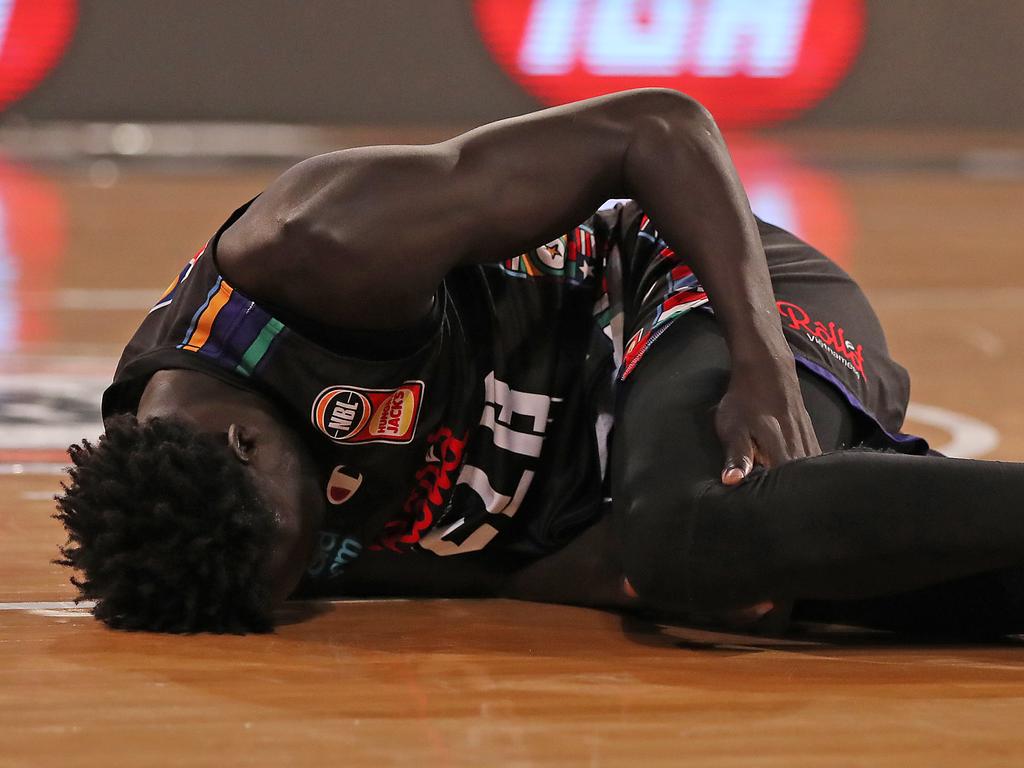 Jo Lual-Acuil went down with a knee injury in the fourth period. (Photo by Will Russell/Getty Images)