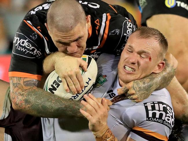 SYDNEY, AUSTRALIA - MARCH 23:  Matthew Lodge of the Broncos is tackled by Russell Packer of the Tigers during the round three NRL match between the Wests Tigers and the Brisbane Broncos at Campbelltown Sports Stadium on March 23, 2018 in Sydney, Australia.  (Photo by Mark Evans/Getty Images)