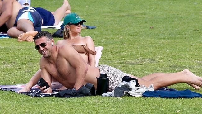 Sam Burgess and Lucy Graham enjoy a day at Bronte Beach Pictured: Background